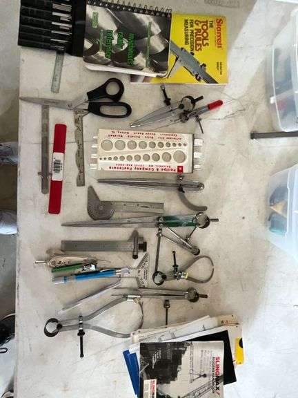 Calipers, scissors, machinist books image