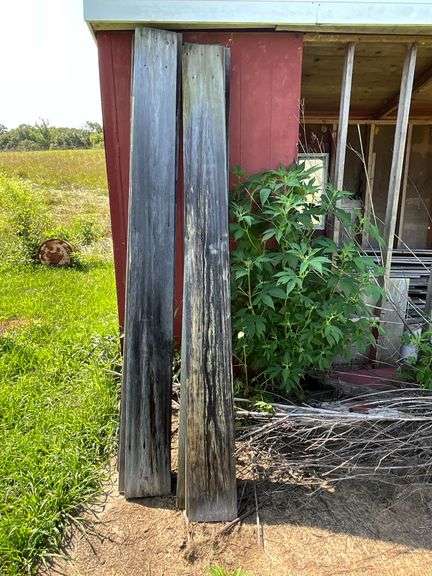 Barn wood up to 9' L, pair of 55 gallon metal barrels. image
