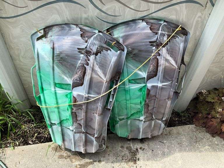 Pair of plastic sleds image