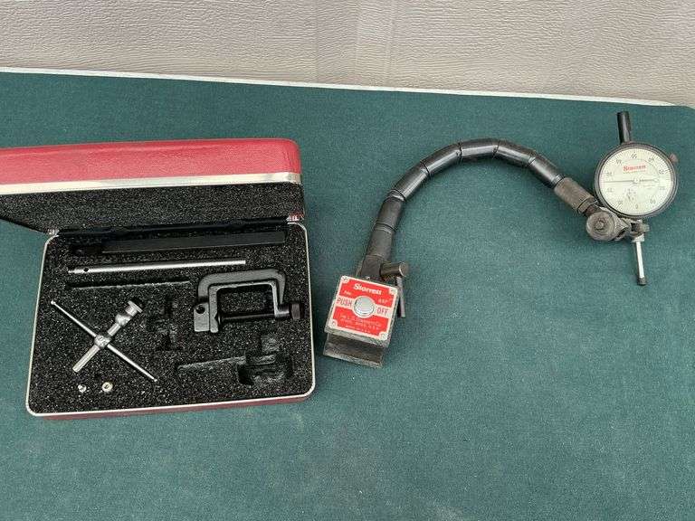 Starrett dial indicator mounted on a Starrett magentic base No. 657. image
