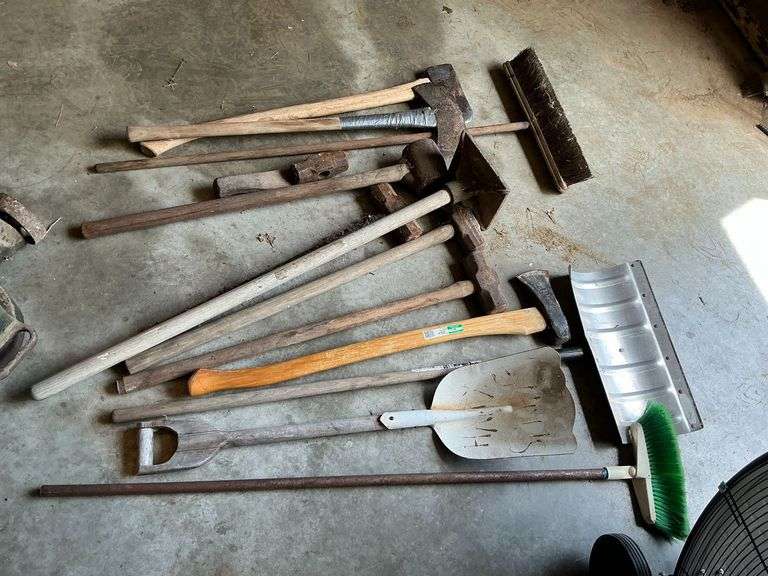 Long handled tools, broom, snow shovel, tamper, etc. image