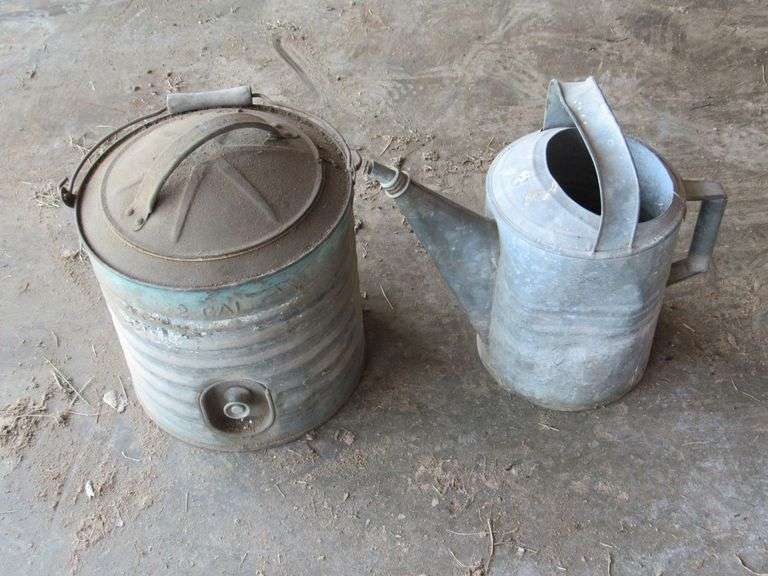 Pair of watering cans image