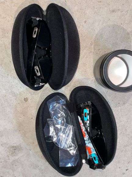 2 pairs of Oakley sunglasses in cases