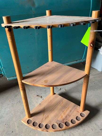Wooden corner fishing pole stand image
