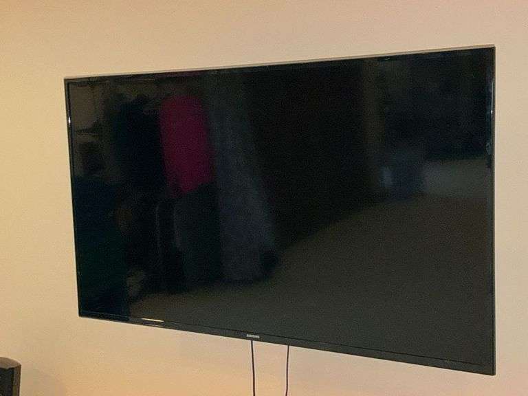 Samsung flatscreen TV with remote, 43" image