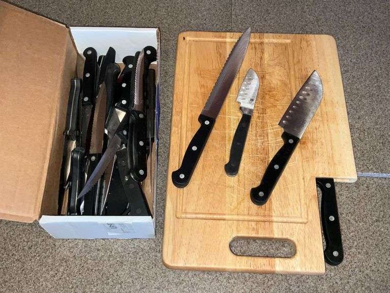 Ginsu and other knives with wooden cutting board image