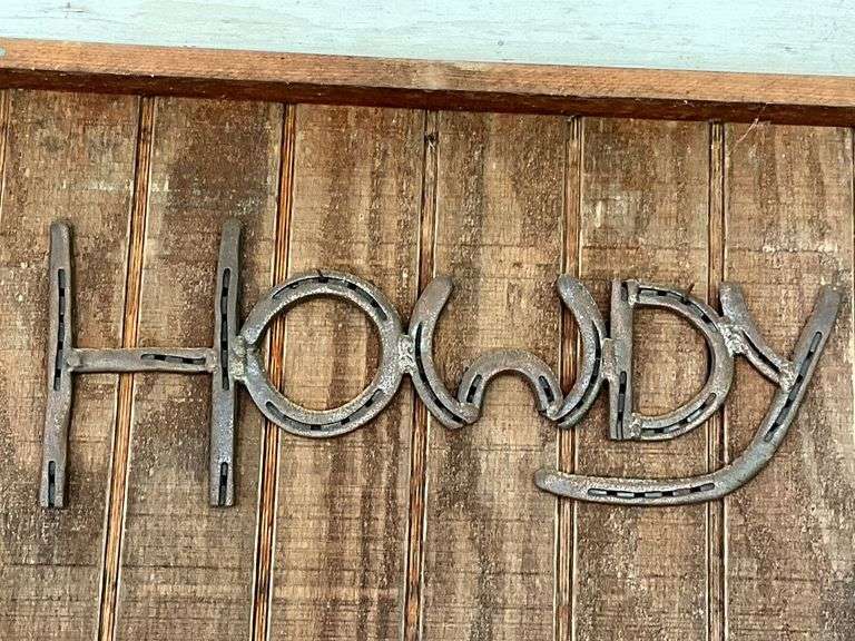 "Howdy" made out of horseshoes image