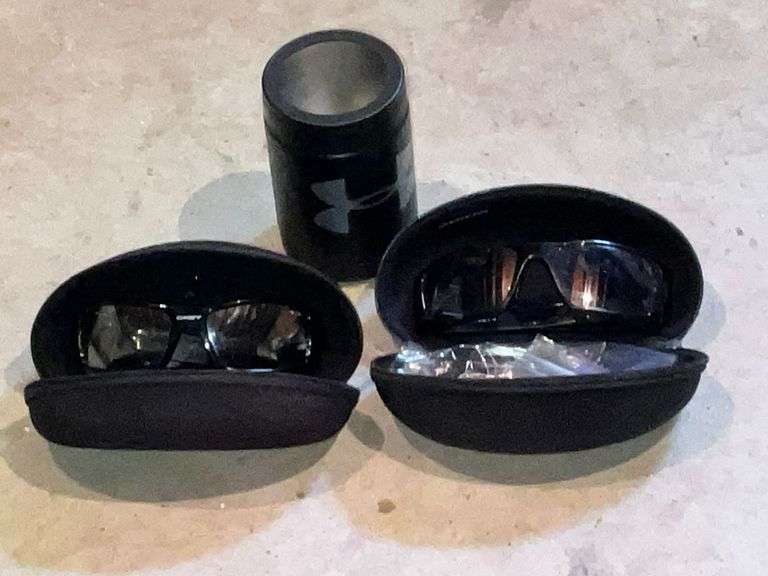 2 pairs of Oakley sunglasses in cases