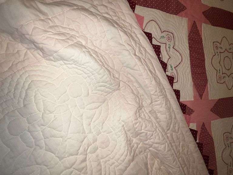 Embroidered quilt, some fading, hand quilted image