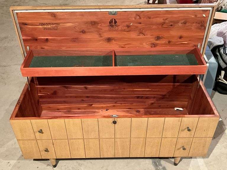Lane cedar chest on legs, water damage on one end to the veneer