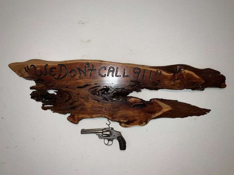 "We Don't Call 911" plaque with non-working Smith & Wesson revolver image
