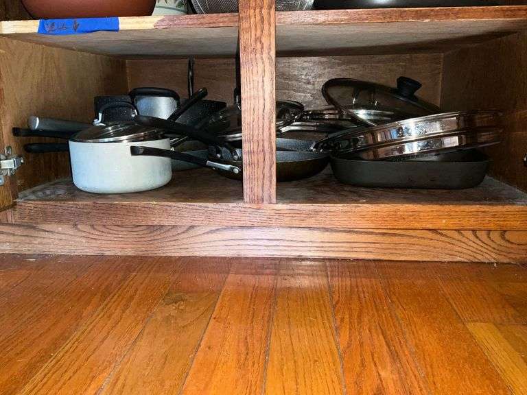 Assorted pots and pans, skillets, some with lids image
