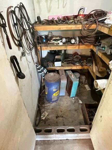 Gauges, box fans, tractor lights, barrel half full of car wash soap, etc. image