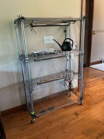 Metal shelf with grow lights, etc. image