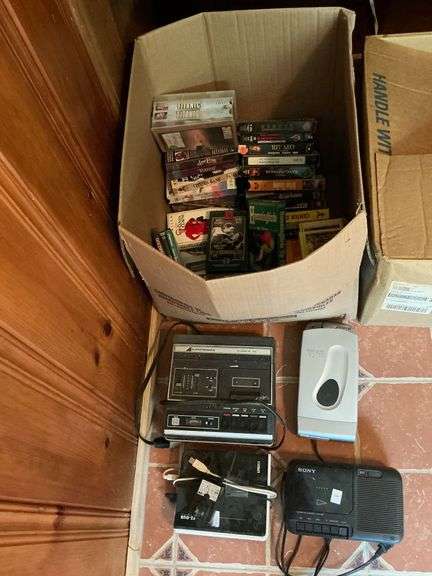 VHS tapes and assorted electronics image