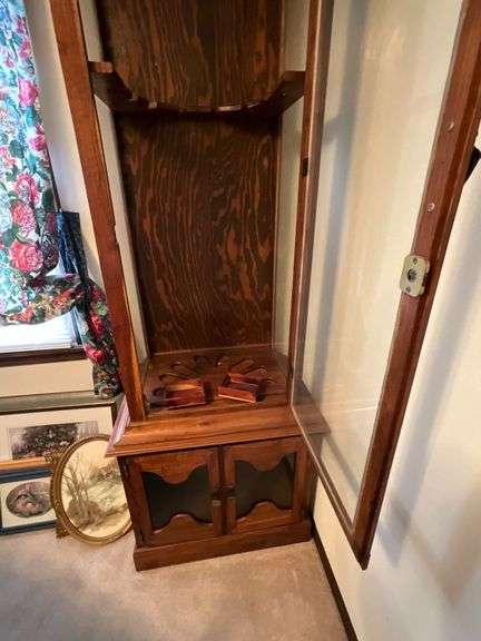 Wooden gun cabinet with glass doors, no keys image