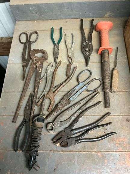 Tin snips, pliers, ram set gun, etc. image