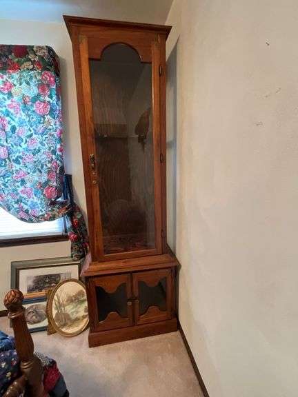 Wooden gun cabinet with glass doors, no keys image