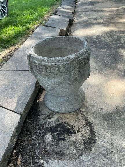 Pair of concrete planters, one with damage to the base image