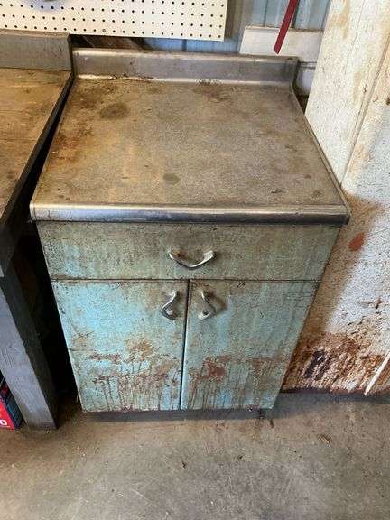 Metal cabinet with drawer image