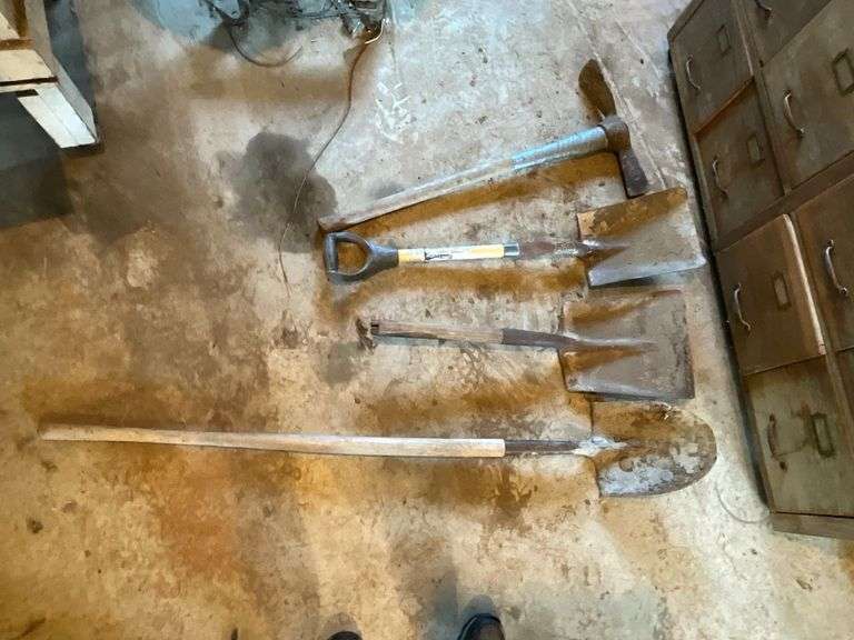 Long handled tools, round point, pick ax, etc. image