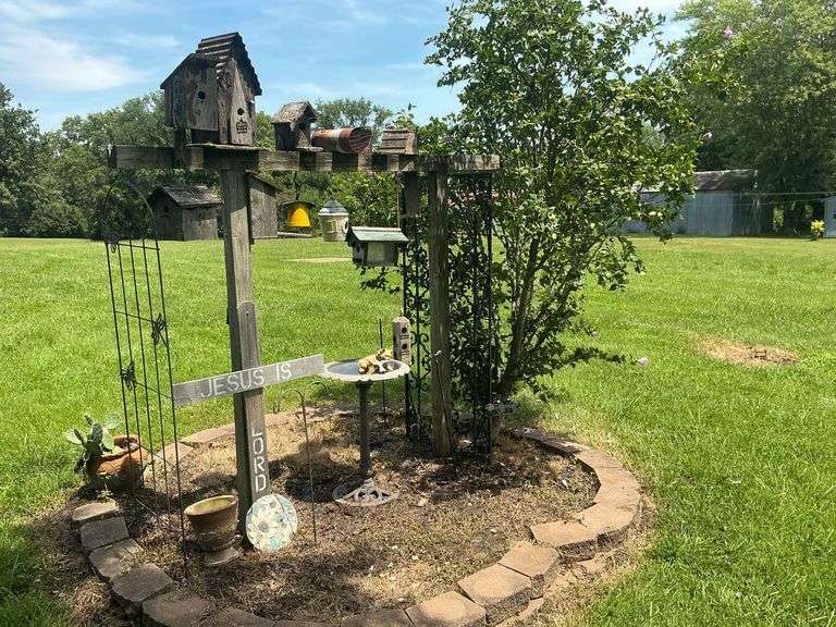 Trellis, metal bird bath, birdhouses, etc. image
