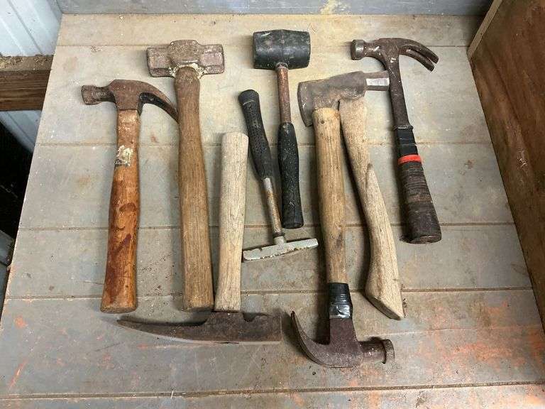 Assortment of hammers, claw, sledge hammer, rock and others image