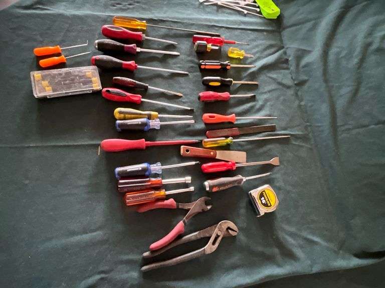 Screwdrivers, tape measurer, pliers, etc. image
