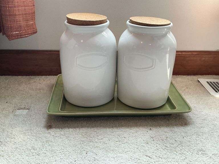 Green tray with pair of pottery canisters image