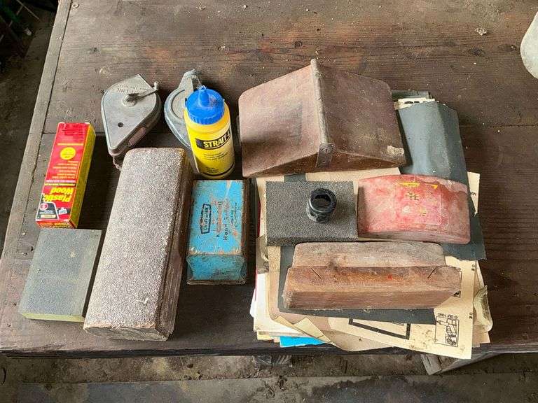 Wooden sanding blocks, chalk lines, sand paper, etc. image