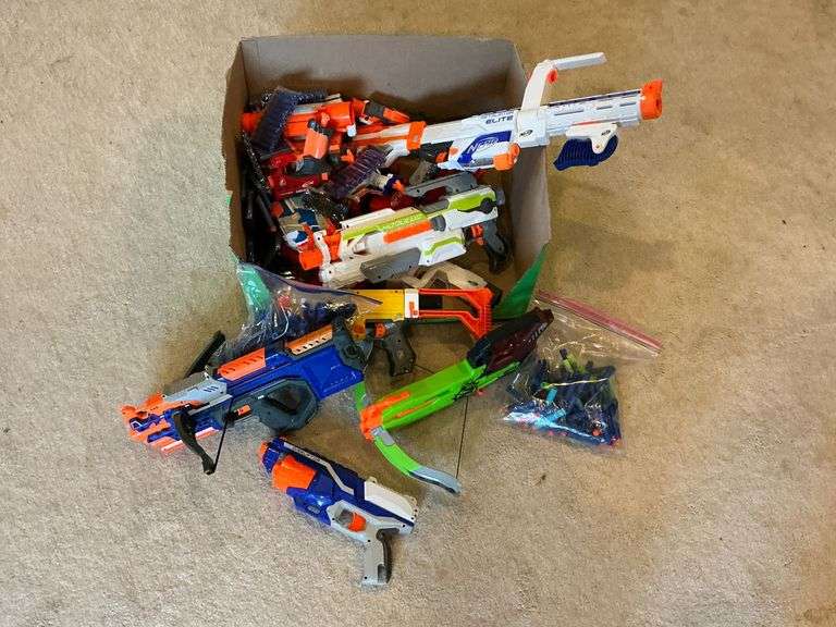 Assortment of Nerf guns and bullets image