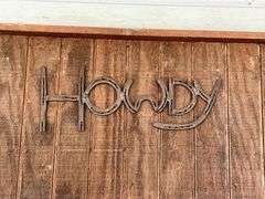 "Howdy" made out of horseshoes