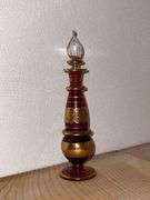 Ruby and gold decorated perfume bottle
