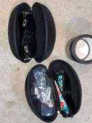 2 pairs of Oakley sunglasses in cases