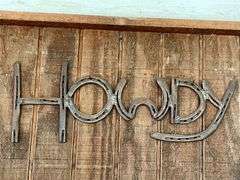 "Howdy" made out of horseshoes