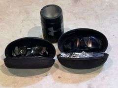2 pairs of Oakley sunglasses in cases