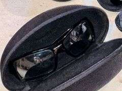 2 pairs of Oakley sunglasses in cases