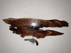 "We Don't Call 911" plaque with non-working Smith & Wesson revolver