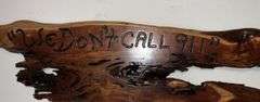 "We Don't Call 911" plaque with non-working Smith & Wesson revolver