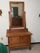 Three-drawer antique dresser with mirror, split in side