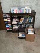 Cabinet with collection of VHS, 8-track tapes, DVDs