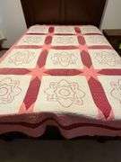 Embroidered quilt, some fading, hand quilted