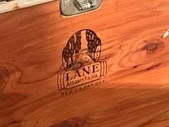 Lane cedar chest on legs, water damage on one end to the veneer