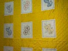 Embroidered blocks flower quilt