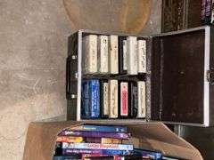 Cabinet with collection of VHS, 8-track tapes, DVDs