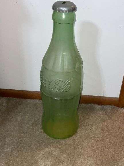 Plastic Coke bottle bank, lid is cracked image