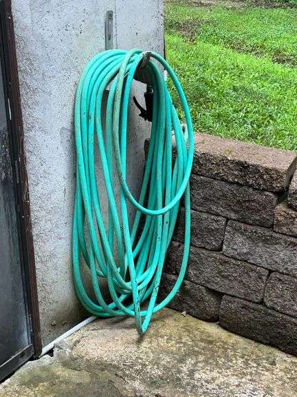 Garden hose with spray nozzle image