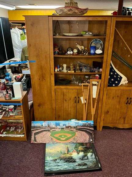 Travel souvenirs, plates, shot glasses, framed puzzles image