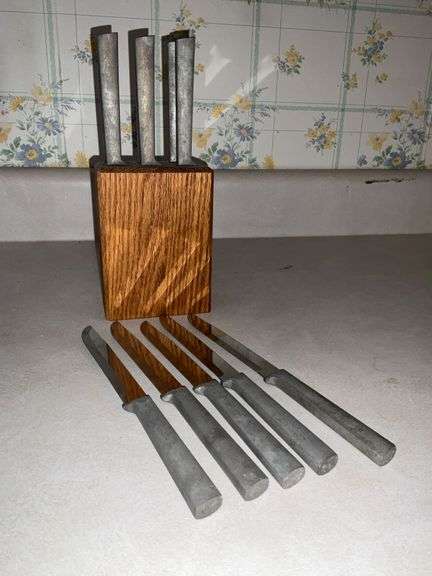 Wooden knife block with aluminum knives image