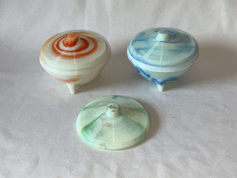 Pair of Akro Agate footed powder jars, blue and white and orange and cream with extra lid image